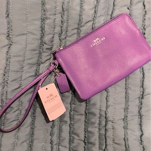 Coach corner zip wristlet in purple. 2card slots NWT